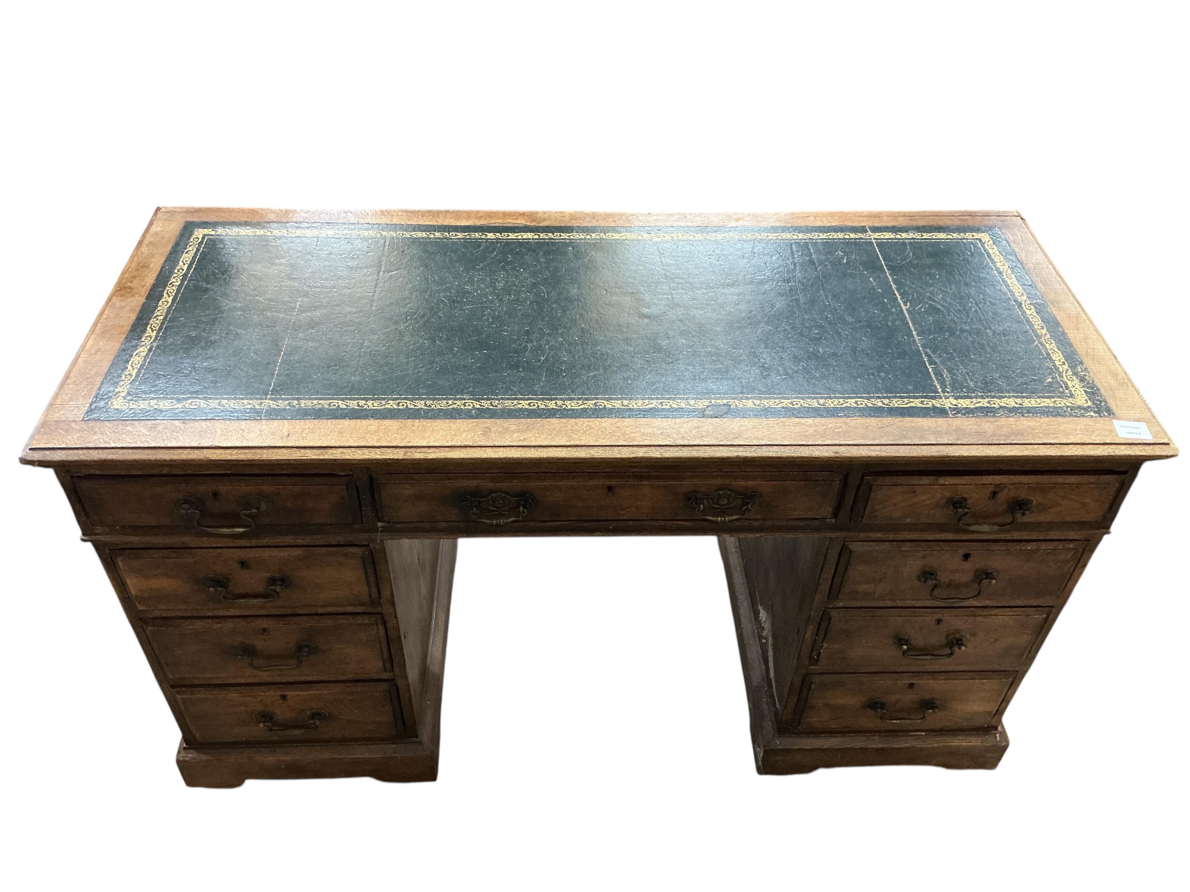 An early 20th century oak pedestal desk, width 138cm, depth 58cm, height 78cm